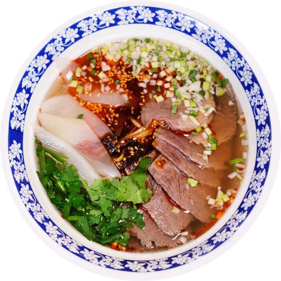 Lanzhou beef noodle soup with sliced beef, radish, cilantro and chili oil