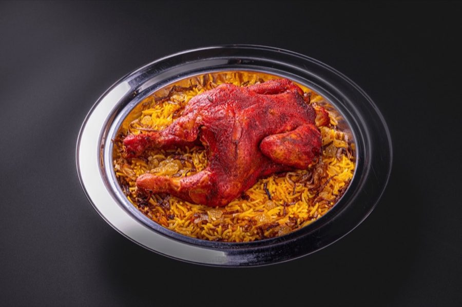 Chicken mandi pictured beside the dish on Yemandi’s official menu