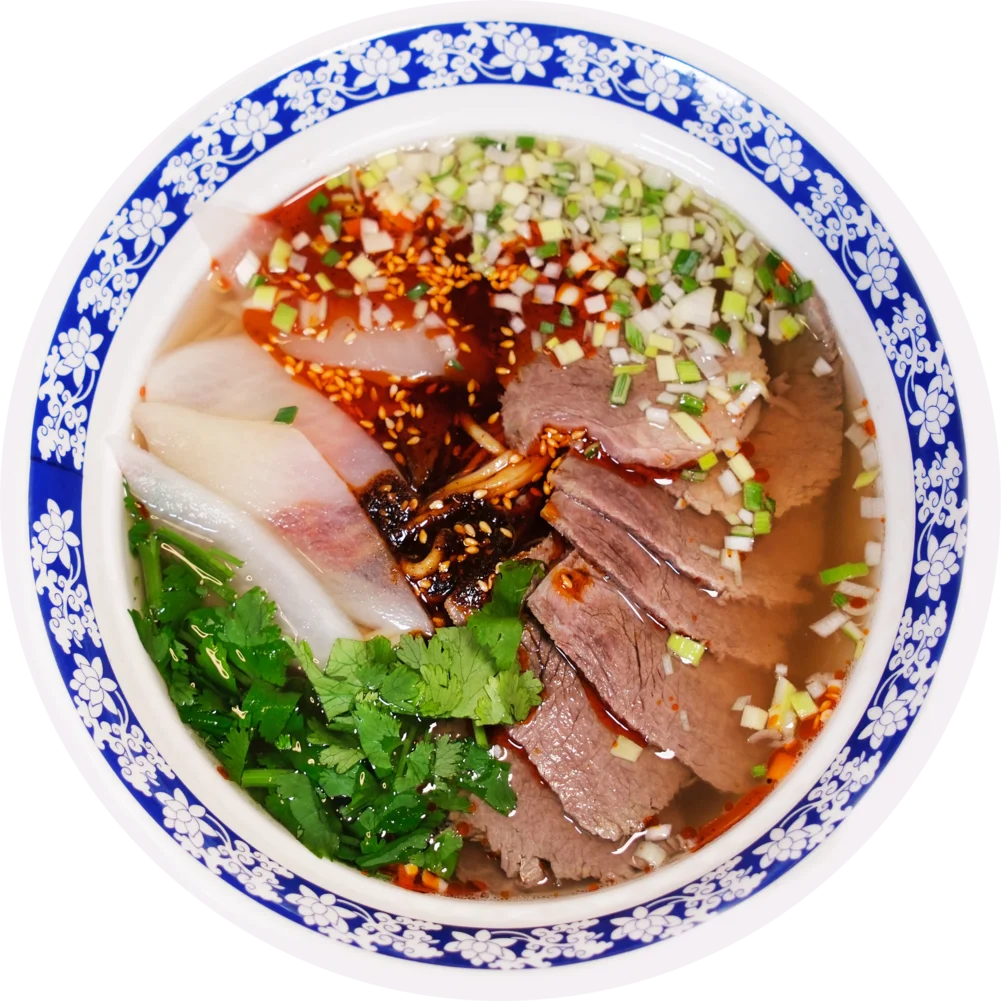 Lanzhou beef noodle soup with sliced beef, radish, cilantro and chili oil